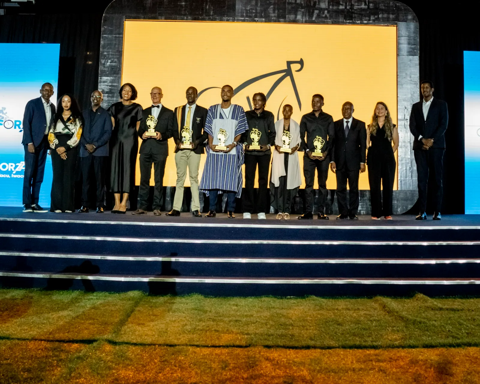 Winners and guests on stage at the close of the ceremony
